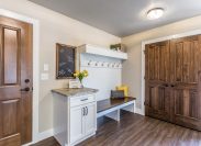 Mudroom with white and wood accents