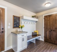 Mudroom with white and wood accents