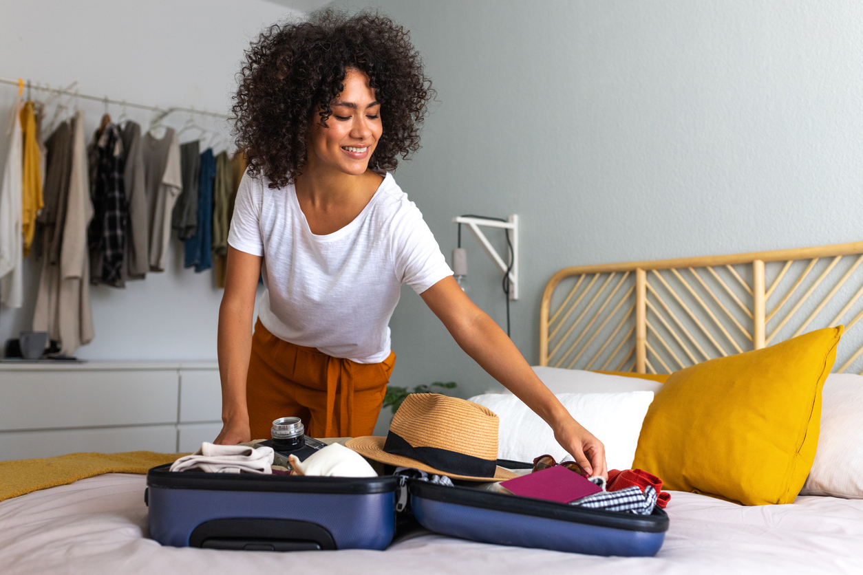 A woman packing her suitcase for a trip