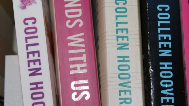 Four Colleen Hoover books on a shelf