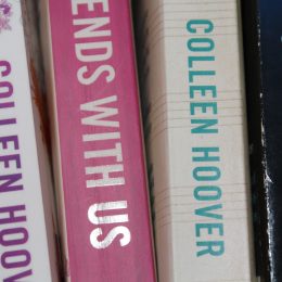 Four Colleen Hoover books on a shelf