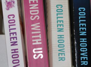Four Colleen Hoover books on a shelf