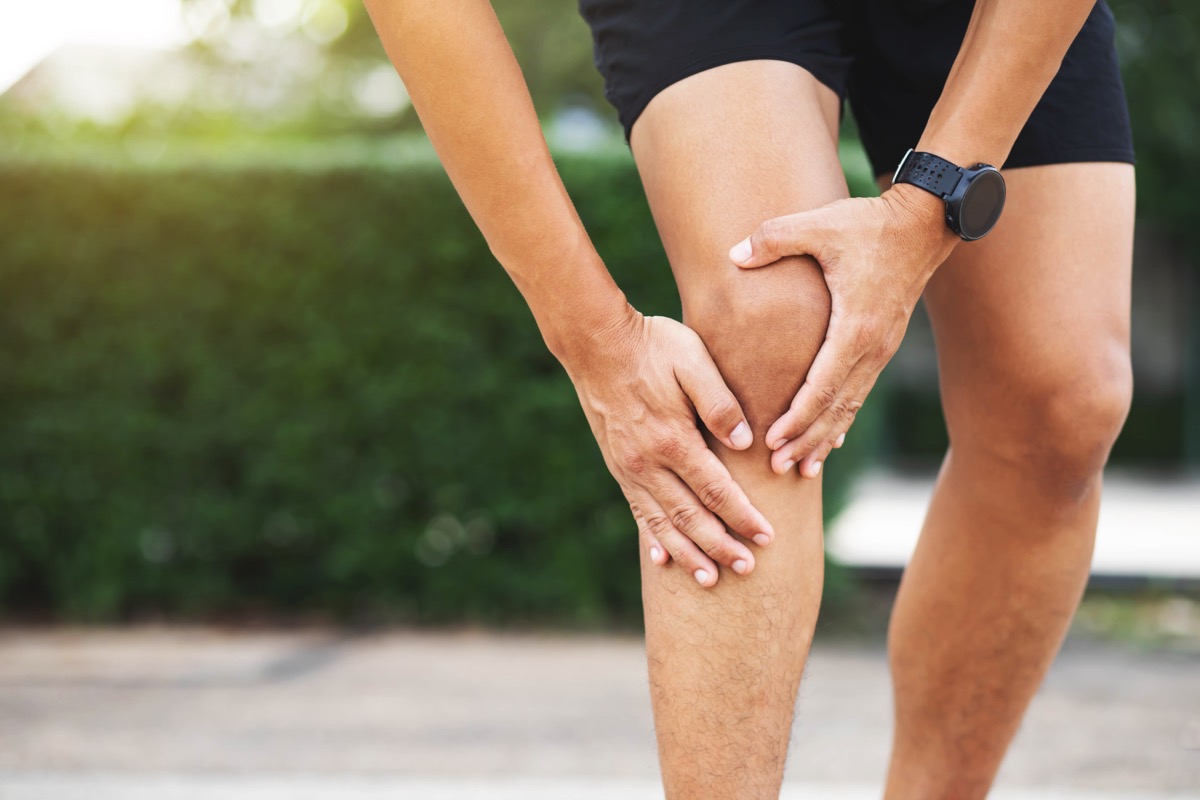 Man experiencing knee pain after running