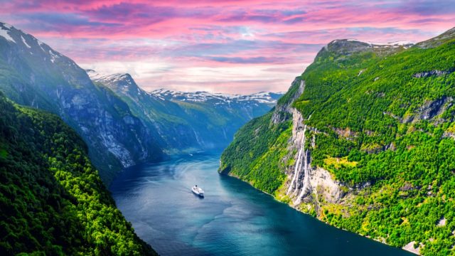 Panorama of breathtaking view of Sunnylvsfjorden fjord and famous Seven Sisters waterfalls, near Geiranger village in western Norway.
