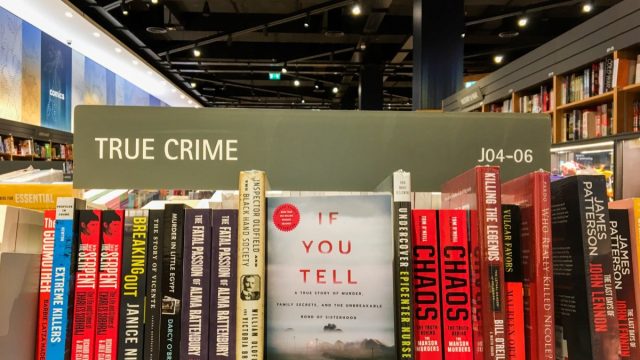 Books on true crime shelf at bookstore