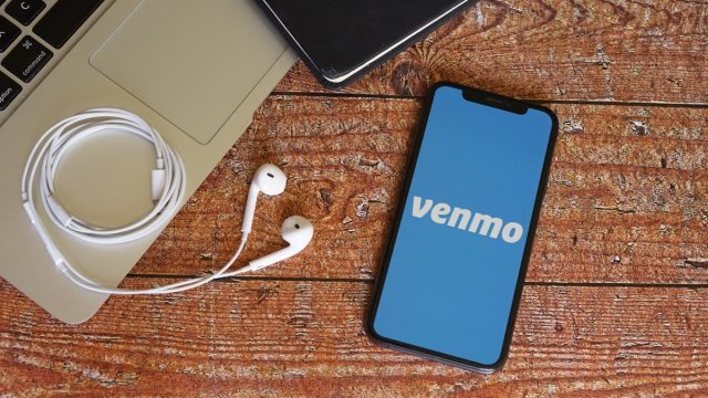 Venmo Iphone Screen with Macbook and Notebook