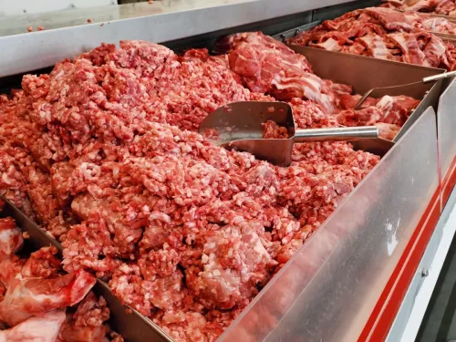 Ground beef ready for sale at shop at meat market.