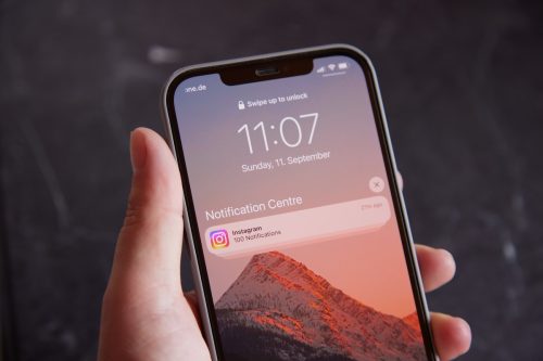 Close up of Instagram Notification on iPhone in Hand