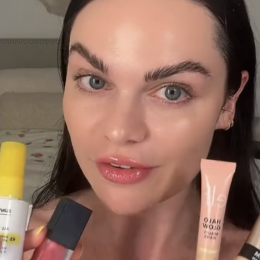 TikToker Kristyn Hoffman holding up makeup