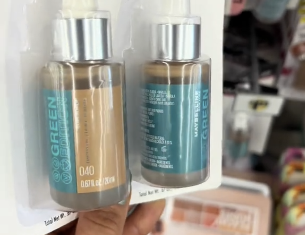 Dollar Tree shopper holding up a tubes of Maybelline makeup