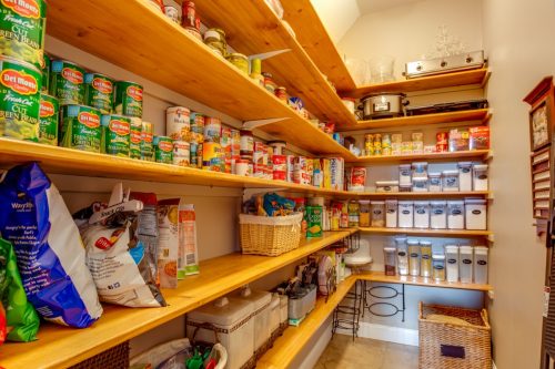 Keystone Heights, Florida / USA - May 24 2020: A well stocked large pantry with canned goods for the coronavirus