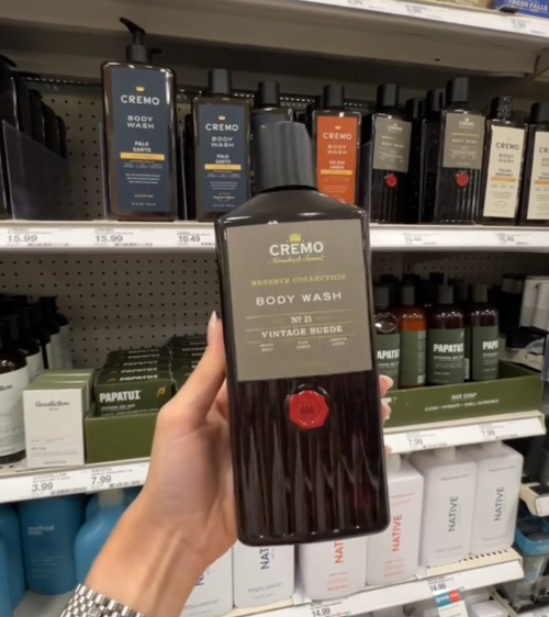 Shopper holding up Cremo body wash at Target