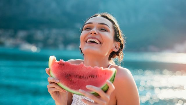 woman eating watermelon