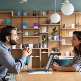 young woman asking for a raise