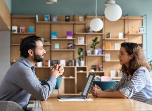 young woman asking for a raise