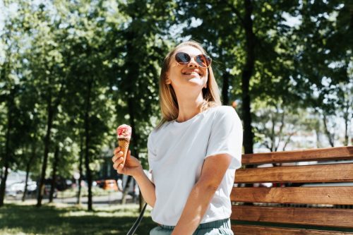woman in the sunshine enjoying ice cream