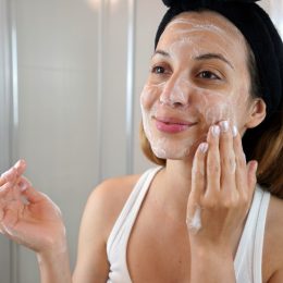 young woman exfoliating
