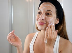 young woman exfoliating