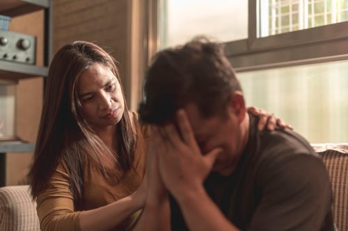 woman comforting crying partner