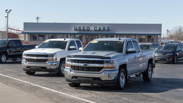used car lot with Chevy pickup trucks