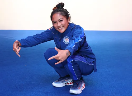 Logan Edra tries on clothes during Team USA Welcome Experience ahead of Paris 2024 Summer Olympics at Nike on July 21, 2024 in Paris, France.