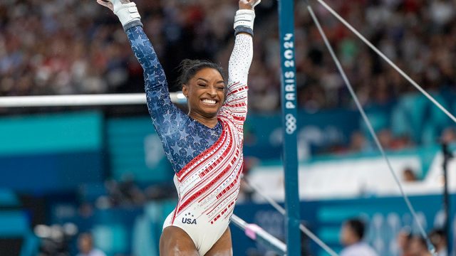 Simone Biles of the United States reacts after performing her uneven bars routine during the Artistic Gymnastics Team Final for Women at the Bercy Arena during the Paris 2024 Summer Olympic Games on July 30th, 2024 in Paris, France.