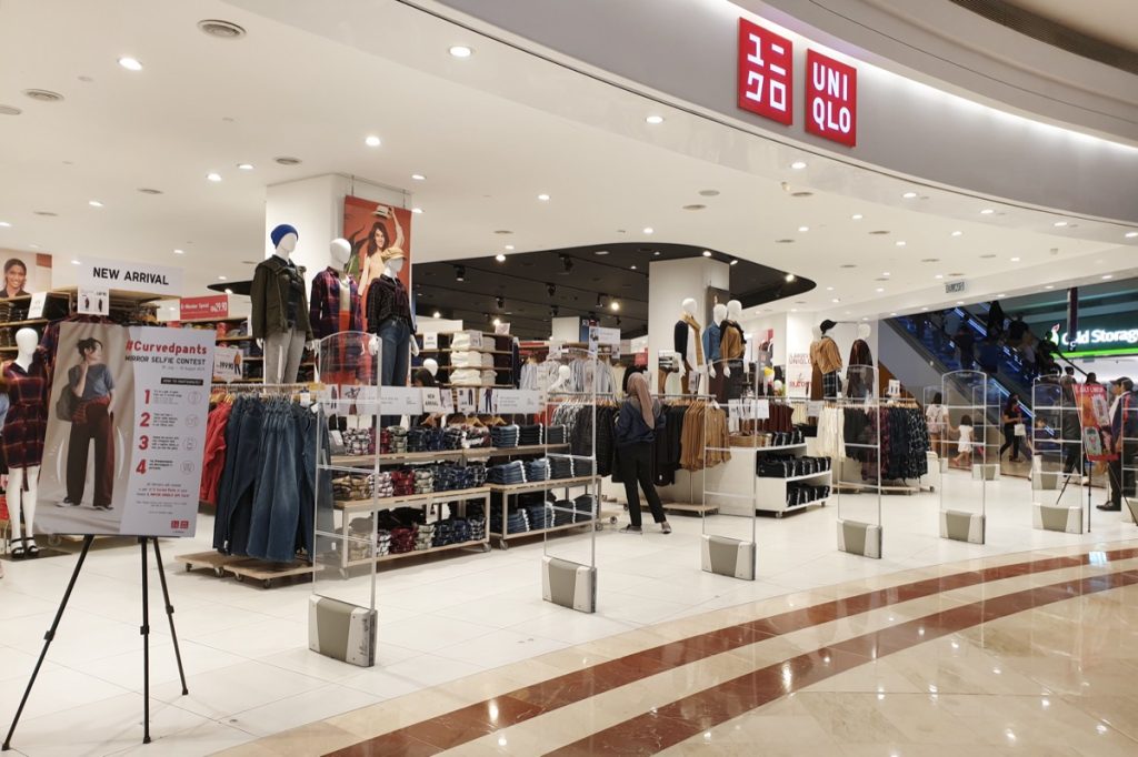 KLCC, MALAYSIA - JULY 27, 2019: Exterior view of Uniqulo store in KLCC mall. Uniqlo is Japan's leading clothing retail chain. It operates in many countries including United States.