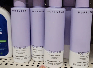 purple bottles of Popsugar body oil on display at Dollar Tree