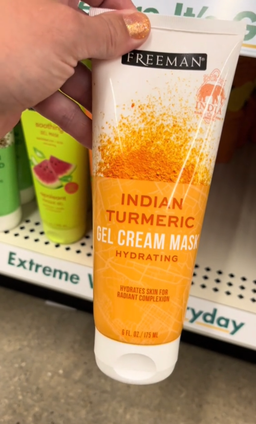 Shopper holding up a turmeric face mask at Dollar Tree