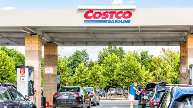 Cars waiting at a Costco gas station on a sunny day