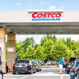 Cars waiting at a Costco gas station on a sunny day