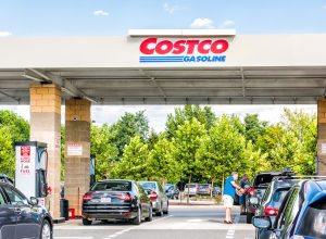 Cars waiting at a Costco gas station on a sunny day
