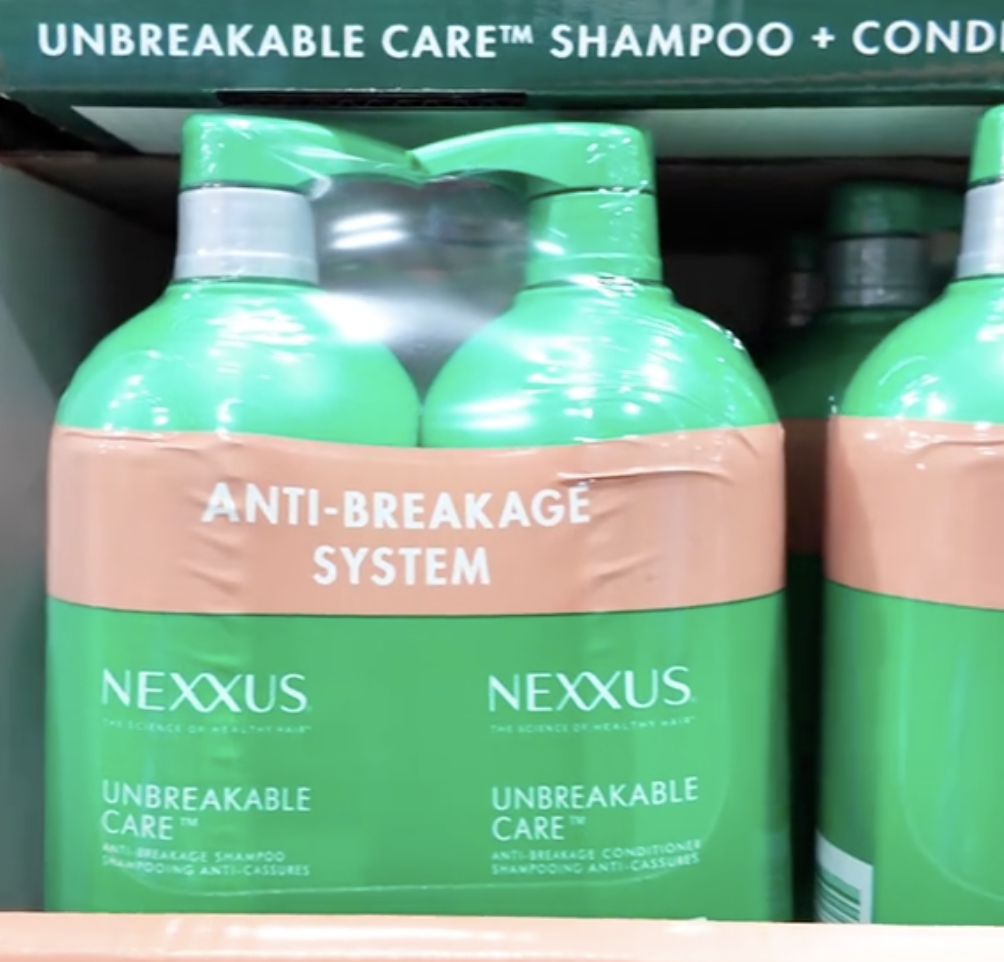 Closeup of Nexxus shampoo and conditioner in green bottles at Costco