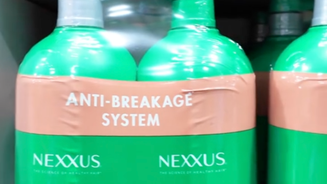 Closeup of Nexxus shampoo and conditioner in green bottles at Costco