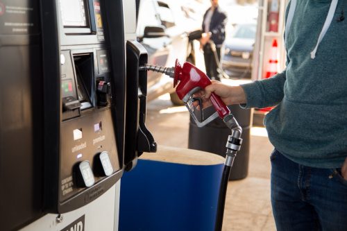 Closeup of a man using the gas pump at Costco