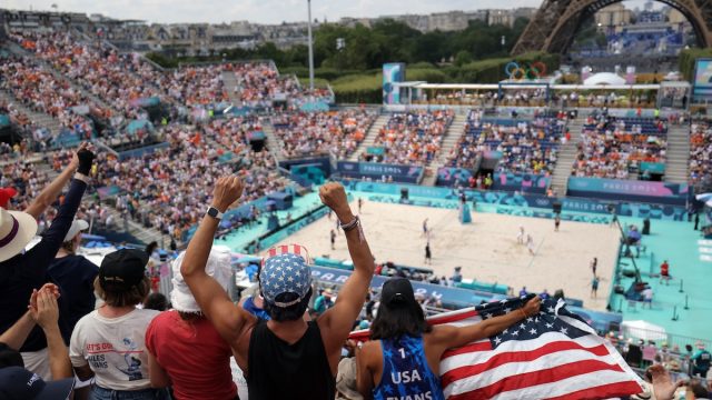 US' fans cheer for their country in the men's pool F beach volleyball match between Spain and USA during the Paris 2024 Olympic Games at the Eiffel Tower Stadium in Paris on August 2, 2024.