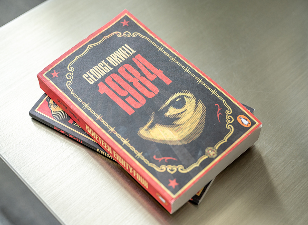 George Orwell's 1984 book on a coffee table.