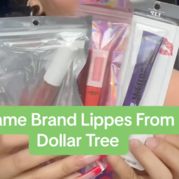 Shopper holding up lipsticks from Dollar Tree