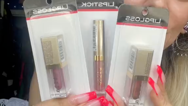 Shopper holding up Stila makeup from Dollar Tree