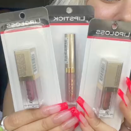 Shopper holding up Stila makeup from Dollar Tree