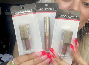 Shopper holding up Stila makeup from Dollar Tree