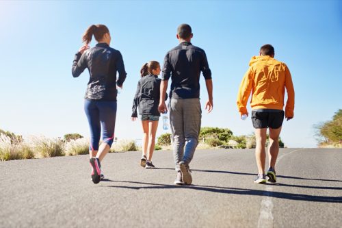 People, friends and walking exercise as group or running community for club sports, hiking or nature. Men, women and back for healthy cardio in California for outdoor training, workout or athlete