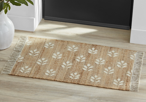 Walmart floral jute rug in a doorway