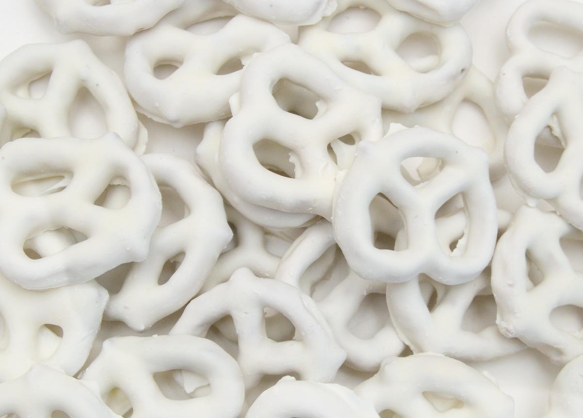 white chocolate covered pretzels on white background