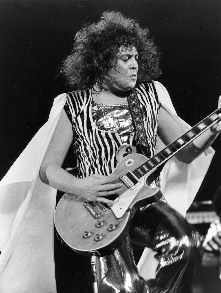 Marc Bolan of T.Rex playing guitar