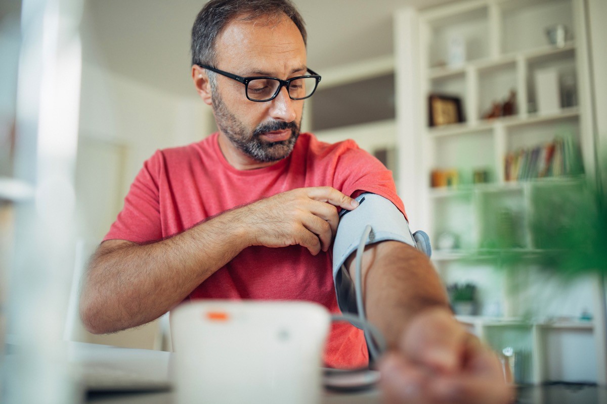 Man checking blood pressure