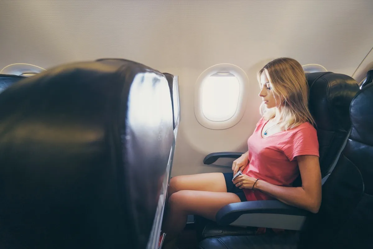 Woman wearing shorts on a plane flight