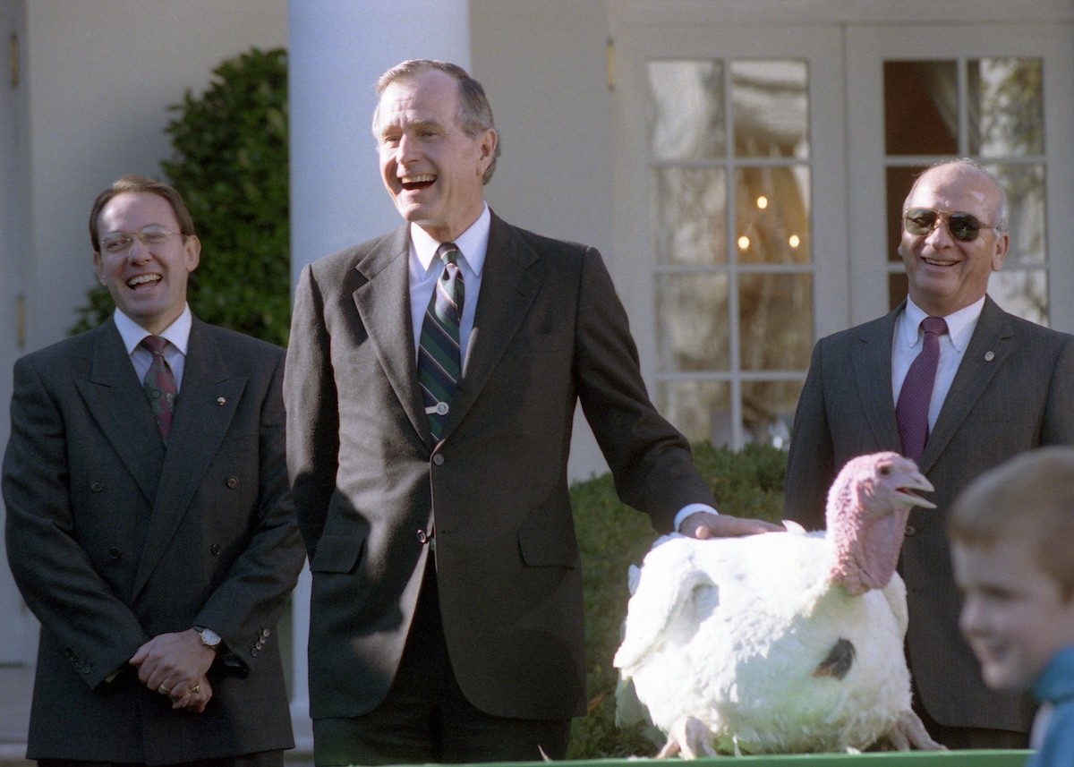 Presient George H.W. Bush pardoning a turkey at the White House in 1990