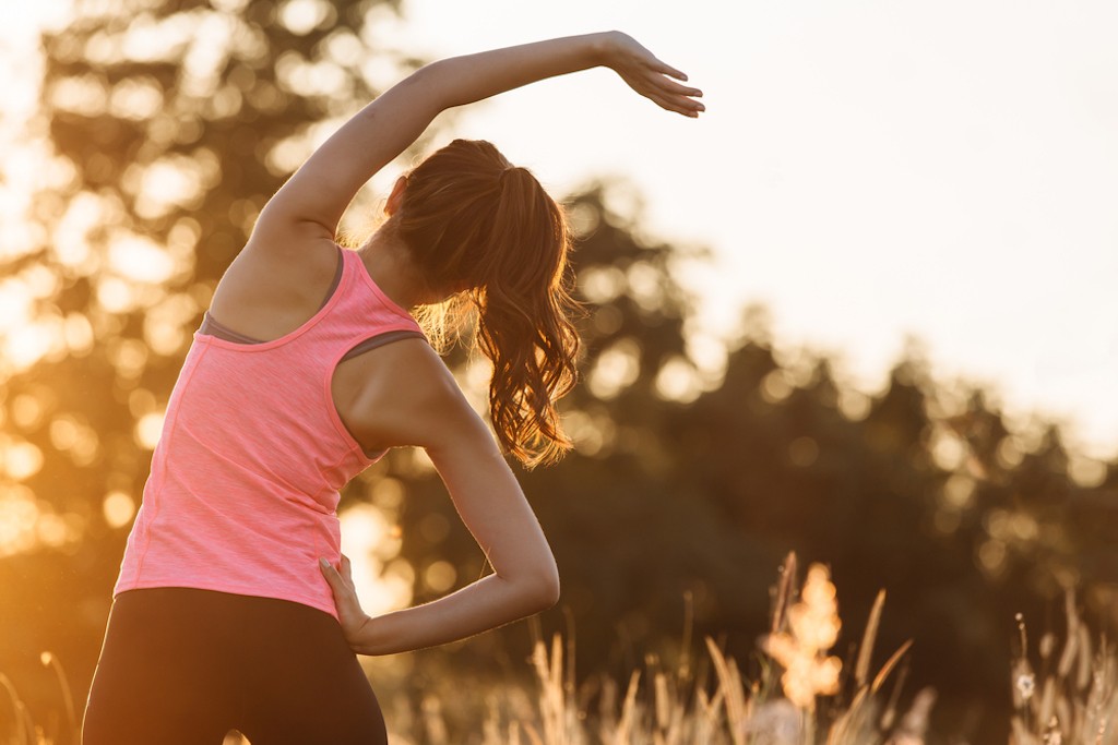 A woman exercising early in the morning.