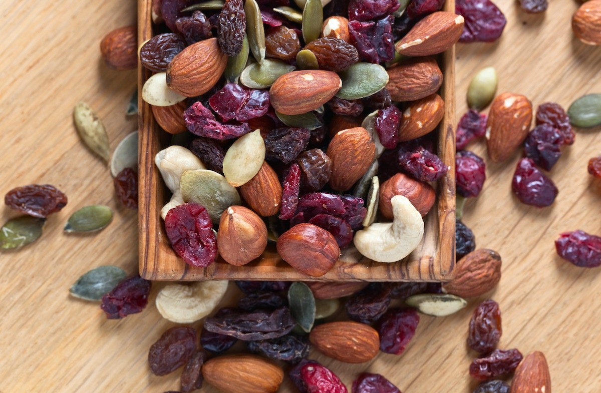healthy homemade trail mix consisting of almonds, raisins, craisins, and sunflower seeds
